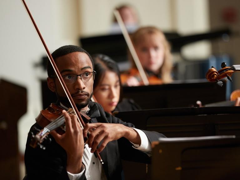 Image card - Violinist playing in orchestra